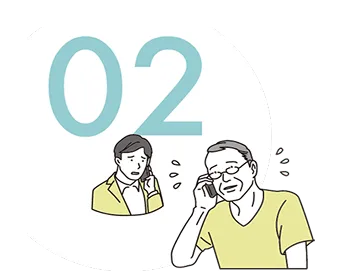 問い合わせの電話をかけている男性